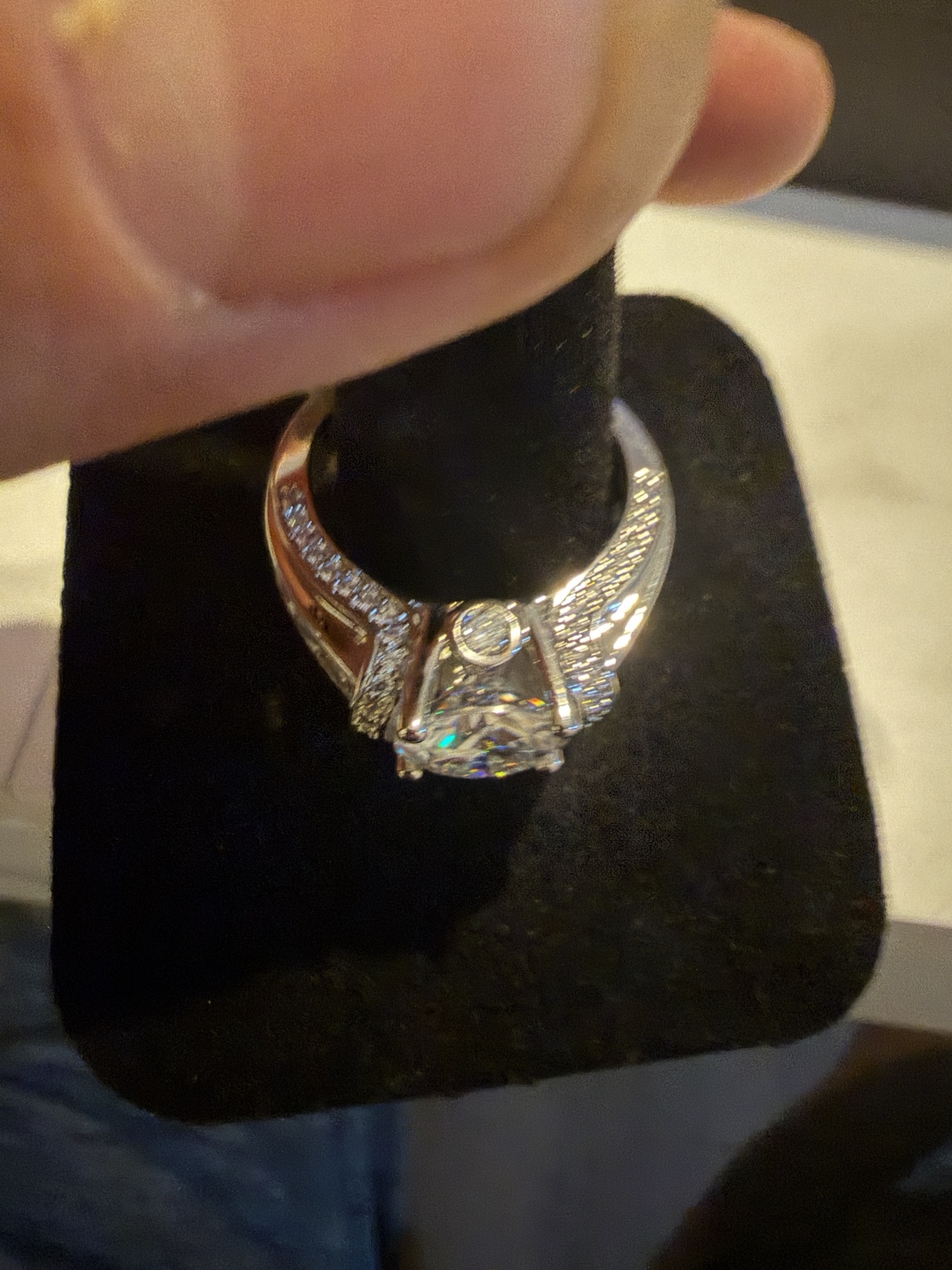 Radiant halo ring with round center stone